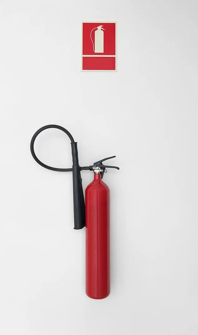 fire extinguisher mounted to a wall